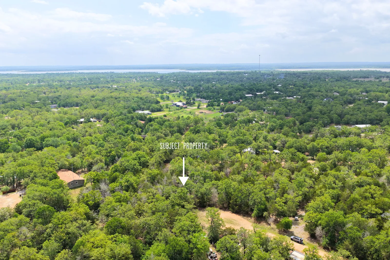 Aerial view of a wooded 2-acre lot on Possum Run near Somerville, Texas