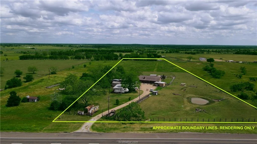 Aerial view of the home and acreage at 7523 State Highway 21 in Caldwell, Texas
